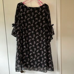 Betsey Johnson knee length black dress with light pink bows, bow detail on arms